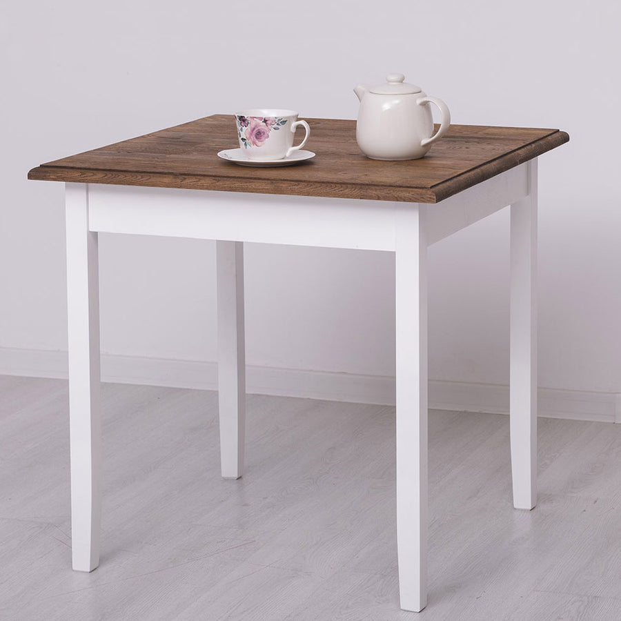 Fenyőfa étkezőasztal. A lábak színe fehér, az asztallap színe barna lakkozott.