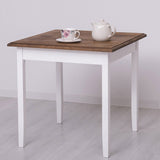 Fenyőfa étkezőasztal. A lábak színe fehér, az asztallap színe barna lakkozott.