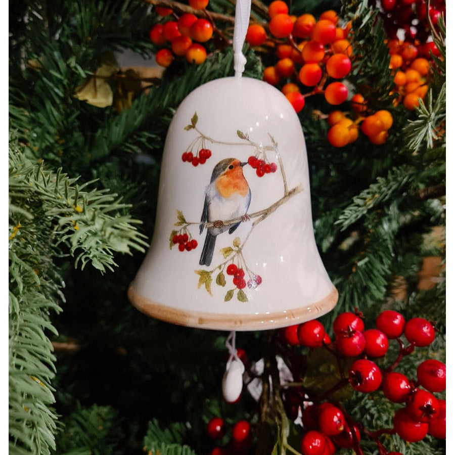 Téli énekesmadárral díszített karácsonyi kerámia harang.