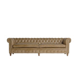 Vintage stílusú, fenyőfa szerkezetű, barna színű bőrrel kárpitozott Chesterfield kanapé.