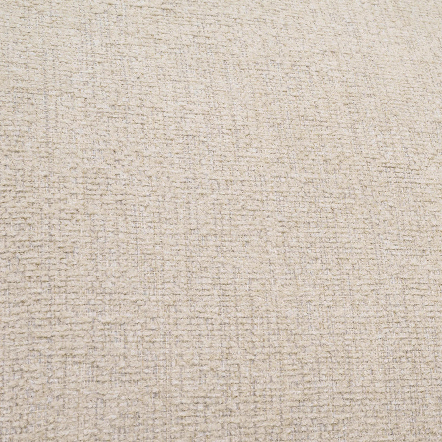 Bézs színű szövettel kárpitozott dizájn fotel.