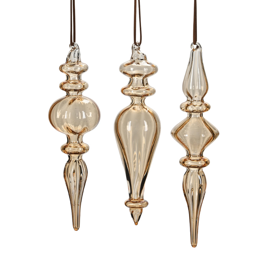 Három darab borostyánsárga, kézzel fújt üveg jégcsap karácsonyfadísz szett, különböző elegáns formákkal.