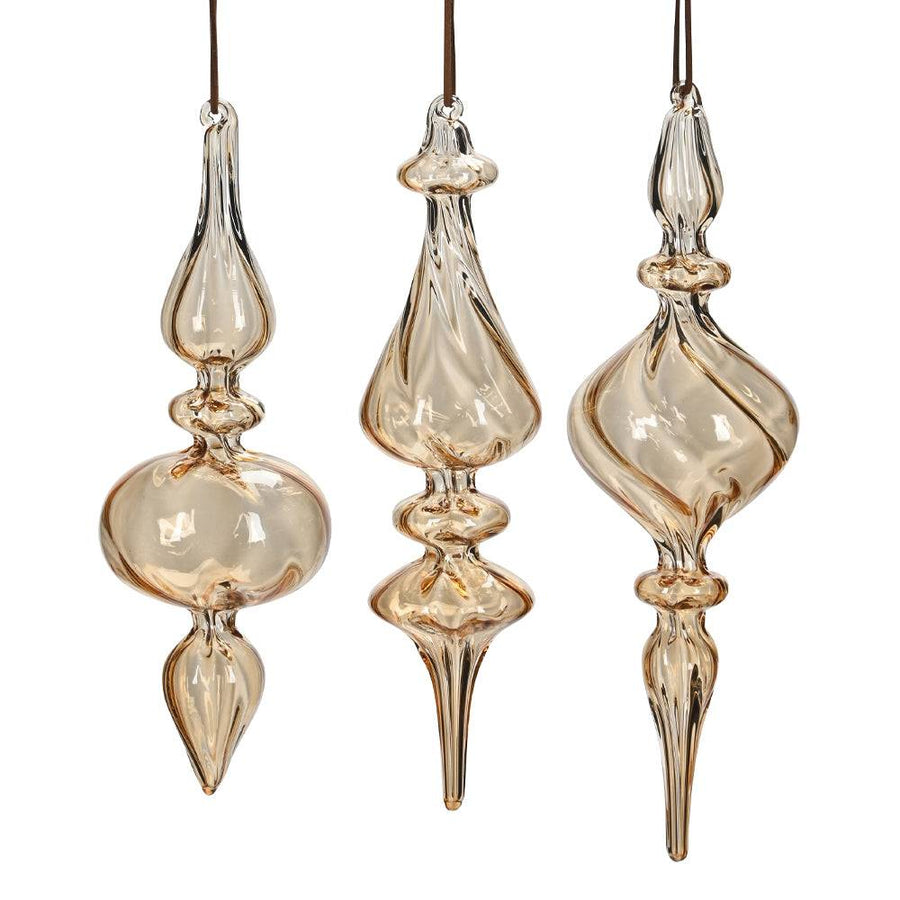 Három darab borostyánsárga, kézzel fújt üveg jégcsap karácsonyfadísz szett, különböző elegáns formákkal.