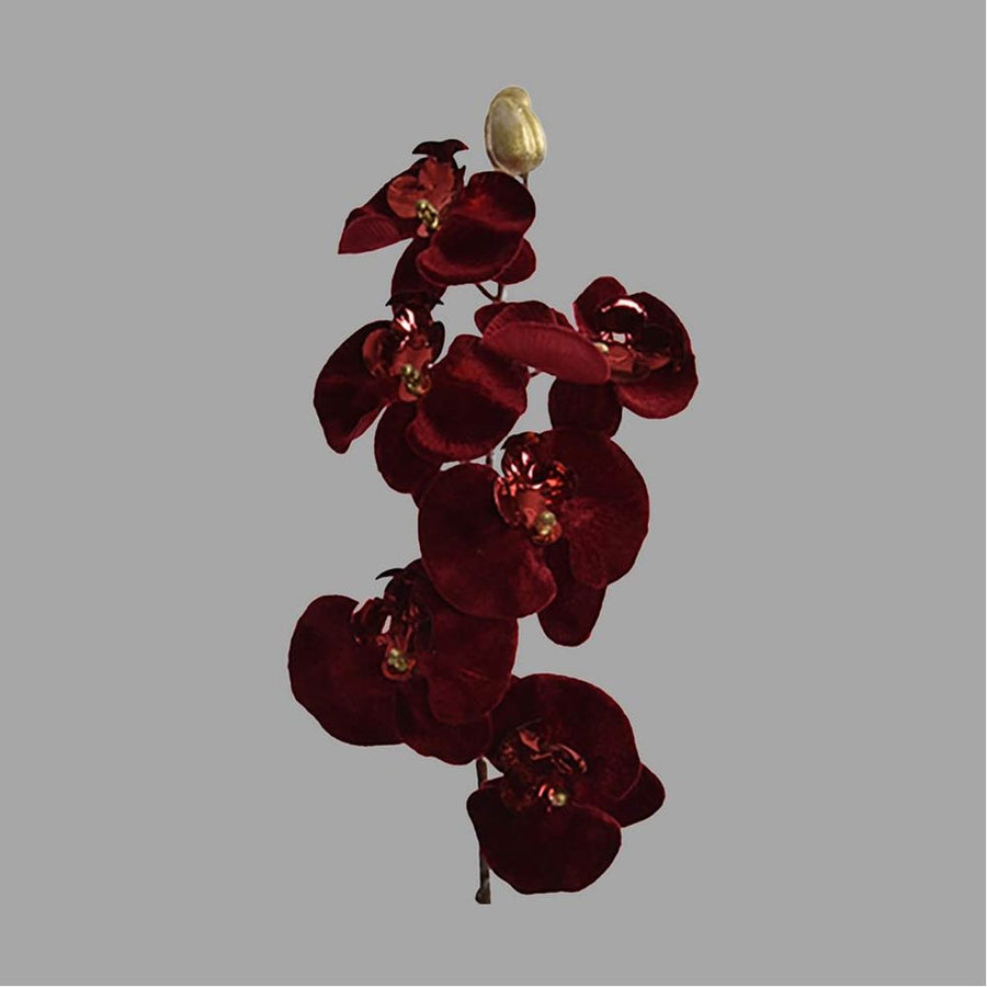 Burgundi színű, bársonyból készült szálas orchidea művirág.