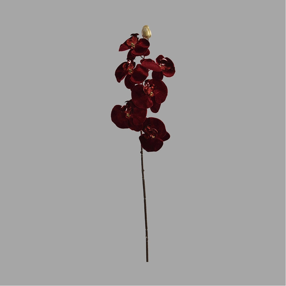 Burgundi színű, bársonyból készült szálas orchidea művirág.