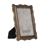 Aranyszínű asztali fényképtartó.