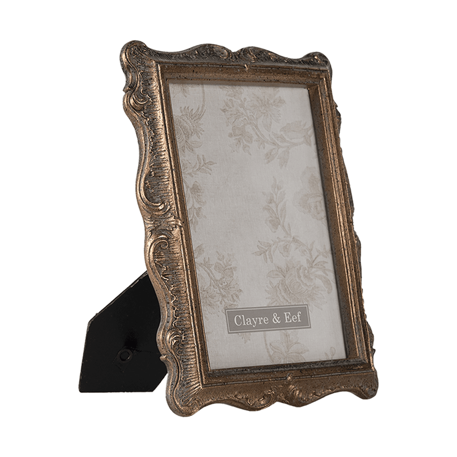 Aranyszínű asztali fényképtartó.