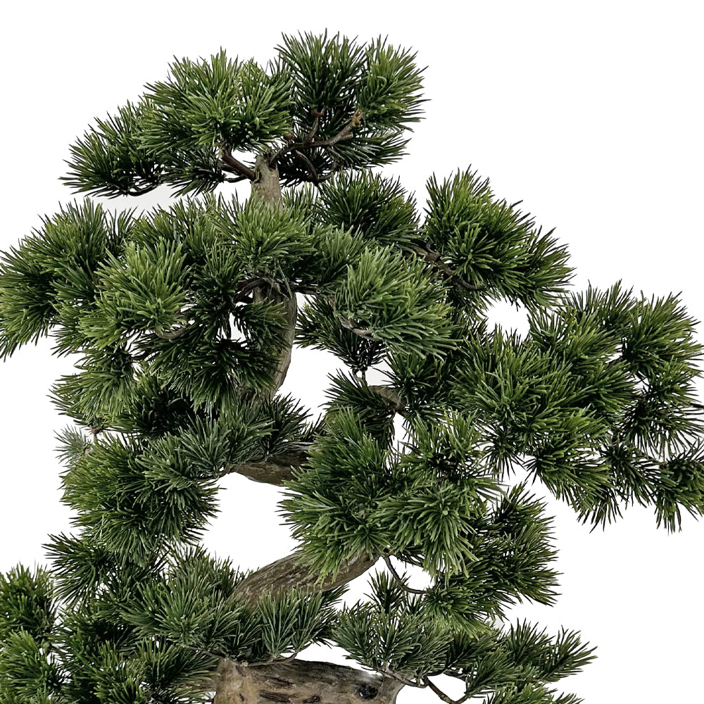 Zöld színű, mű fenyő bonsai fa, fekete színű, ovális műanyag cserépben.