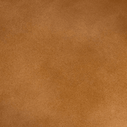 Konyakszínű marhabőrrel kárpitozott, szárnyas bőrfotel.