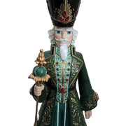 Arany és zöld színű karácsonyi diótörő figura.