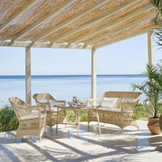 Natúr színű, 2 személyes műrattan kerti kanapé.