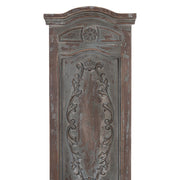 Casa Roma falpanel ovális stílusú díszítéssel, kopottas kékesbarna felületű fából.