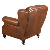 Chester konyakbarna bőrfotel hátulnézetben, fa lábakkal és görgőkkel