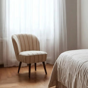 Okker csíkos CLUB EMMA fotel természetes fényben, hálószobai enteriőrben.