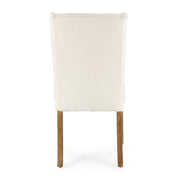 Krémszínű buklészövettel kárpitozott, tölgyfából készült szék.