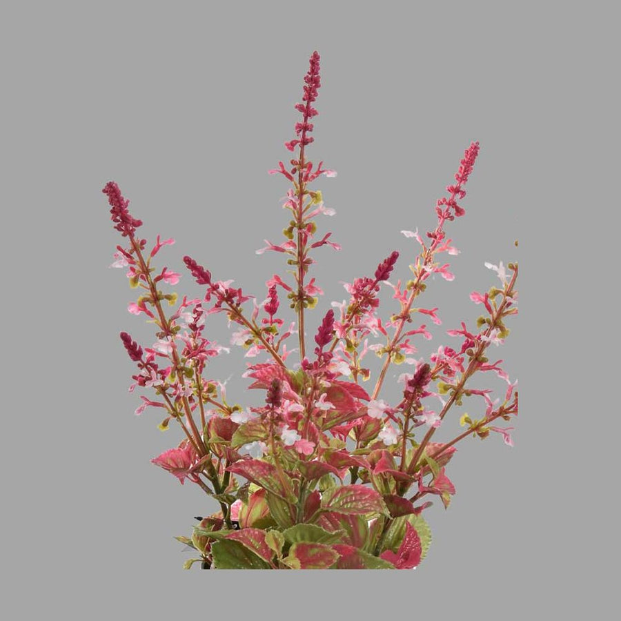 Szürke színű cserépbe helyezett, mű levendula bokor.