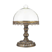 Óarany színű fémből készült, díszes kialakítású süteményes állvány üvegbúrával.