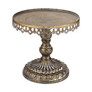 Óarany színű fémből készült, díszes kialakítású süteményes állvány üvegbúrával.