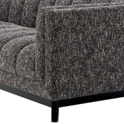 Fekete színű szövettel kárpitozott, prémium minőségű, formatervezett design kanapé.