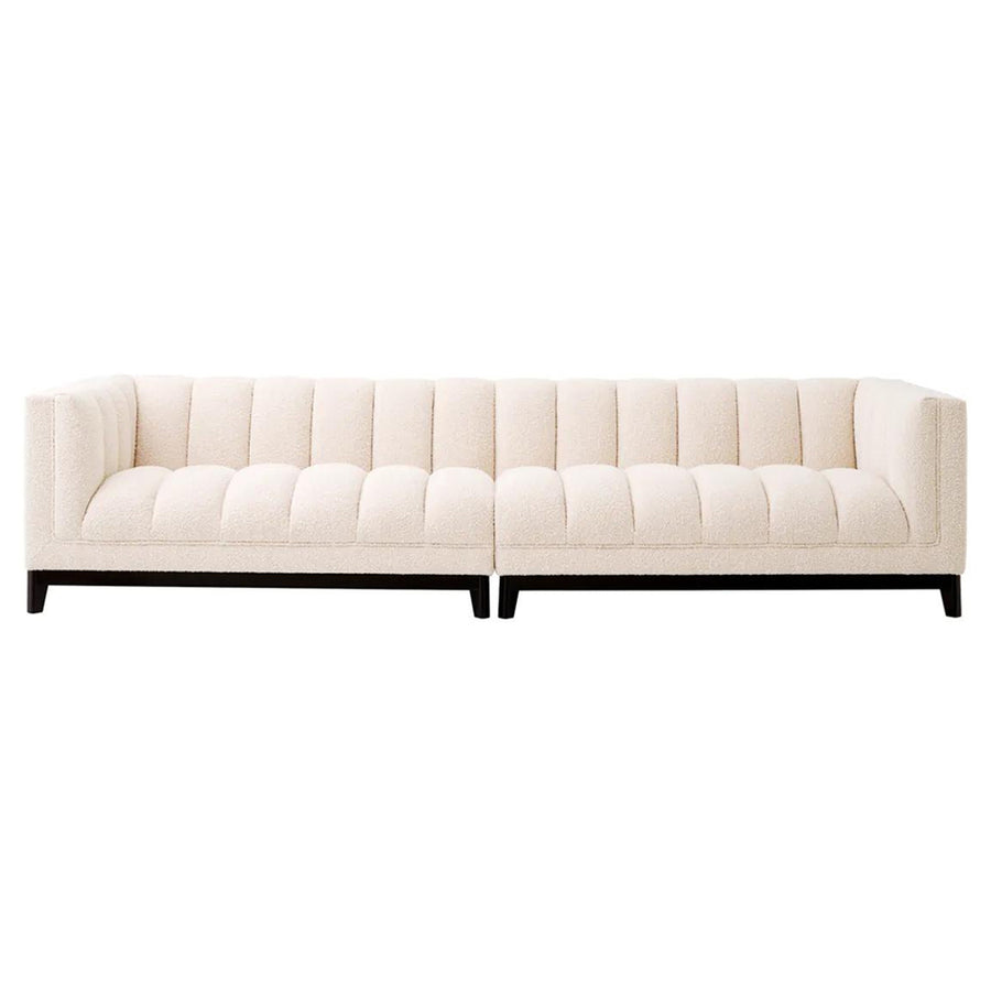 Krémszínű buklé szövettel kárpitozott, prémium minőségű, formatervezett design kanapé.