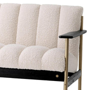 Krémszínű buklé szövettel kárpitozott, prémium minőségű, formatervezett design kanapé.