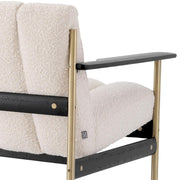 Krémszínű buklé szövettel kárpitozott, prémium minőségű, formatervezett design kanapé.