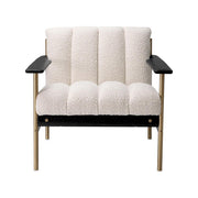 Krémszínű buklé szövettel kárpitozott, prémium minőségű, formatervezett design fotel.