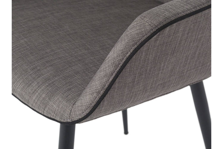 Szürke színű szövettel kárpitozott, acél szerkezetű, formatervezett dizájn étkezőszék.