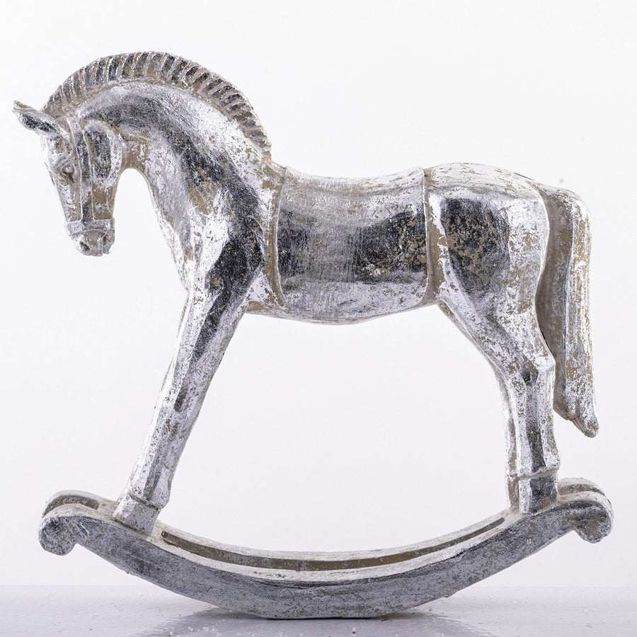 Antikolt felületű, ezüst színű karácsonyi hintaló figura.