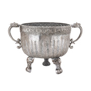 Ezüstszínű, dombormintával díszített, lábakon álló fém kaspótál.