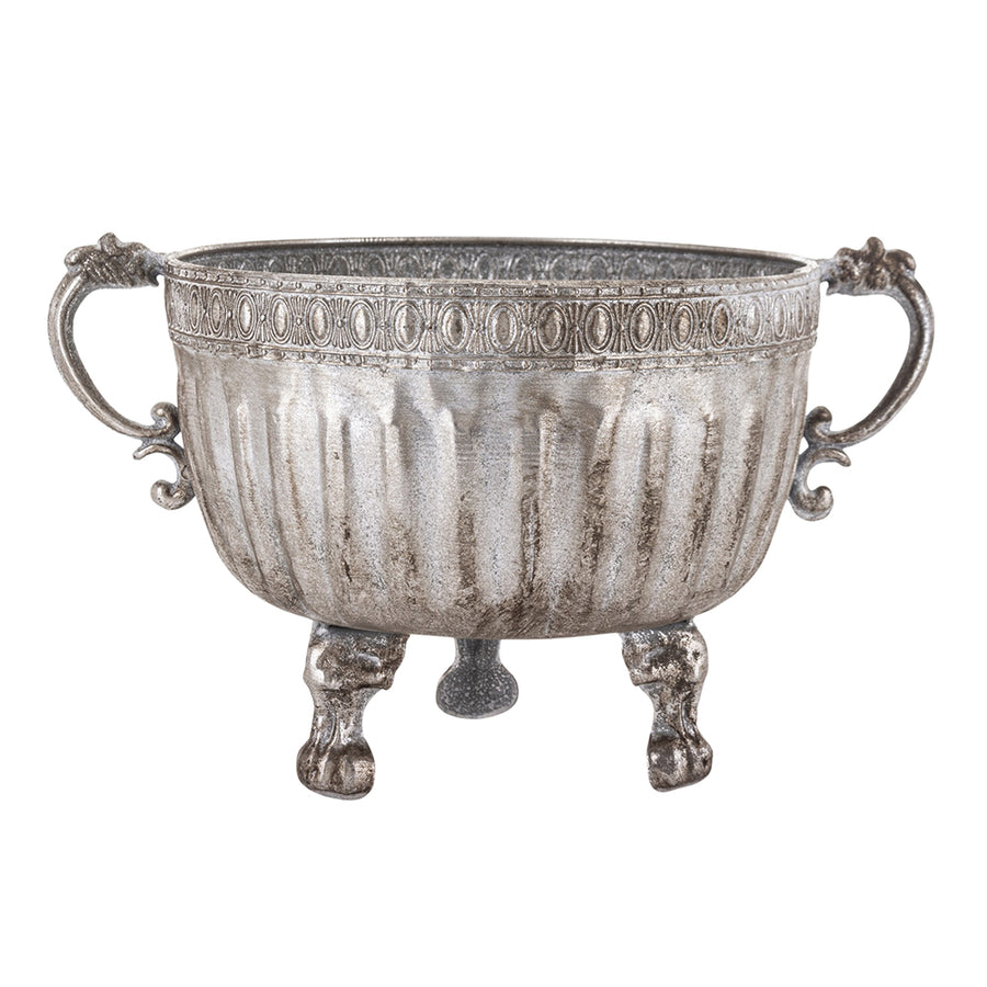 Ezüstszínű, dombormintával díszített, lábakon álló fém kaspó tál.