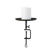 Fekete színű, vasból készült, kézműves gyertyatartó.