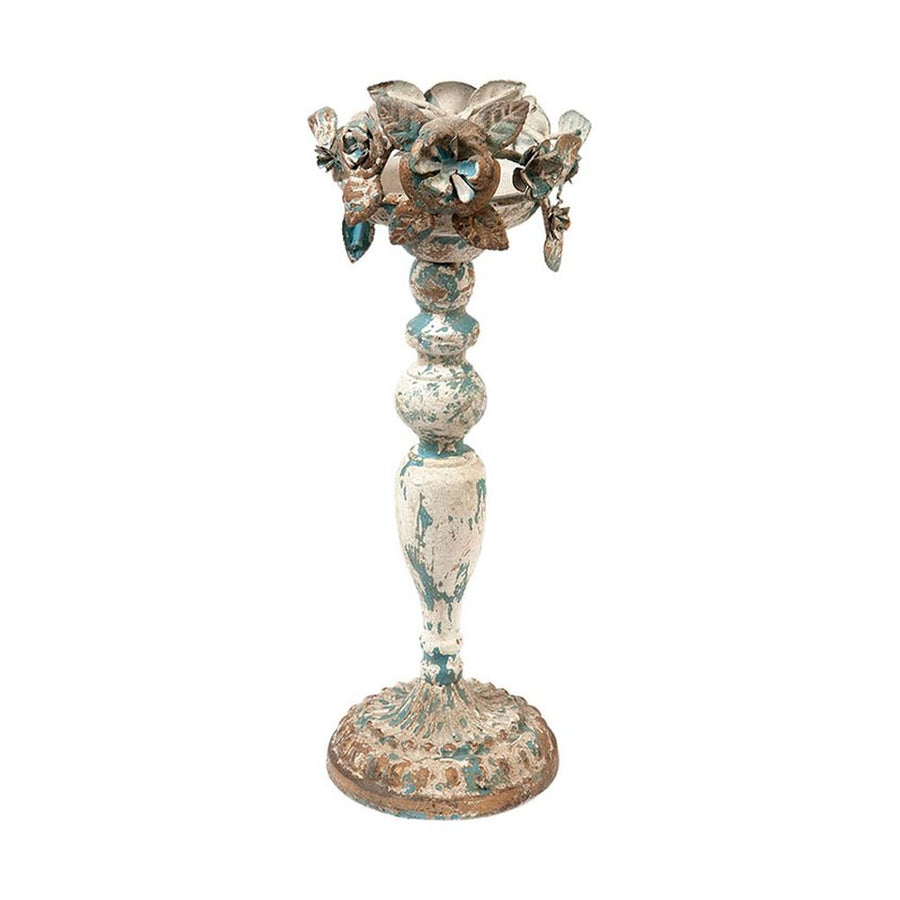 Fém virágokkal díszített gyertyatartó.