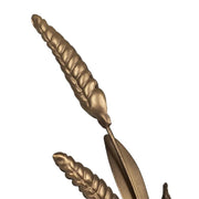 Növényi formát mintázó, antik aranyszínű fém gyertyatartó.