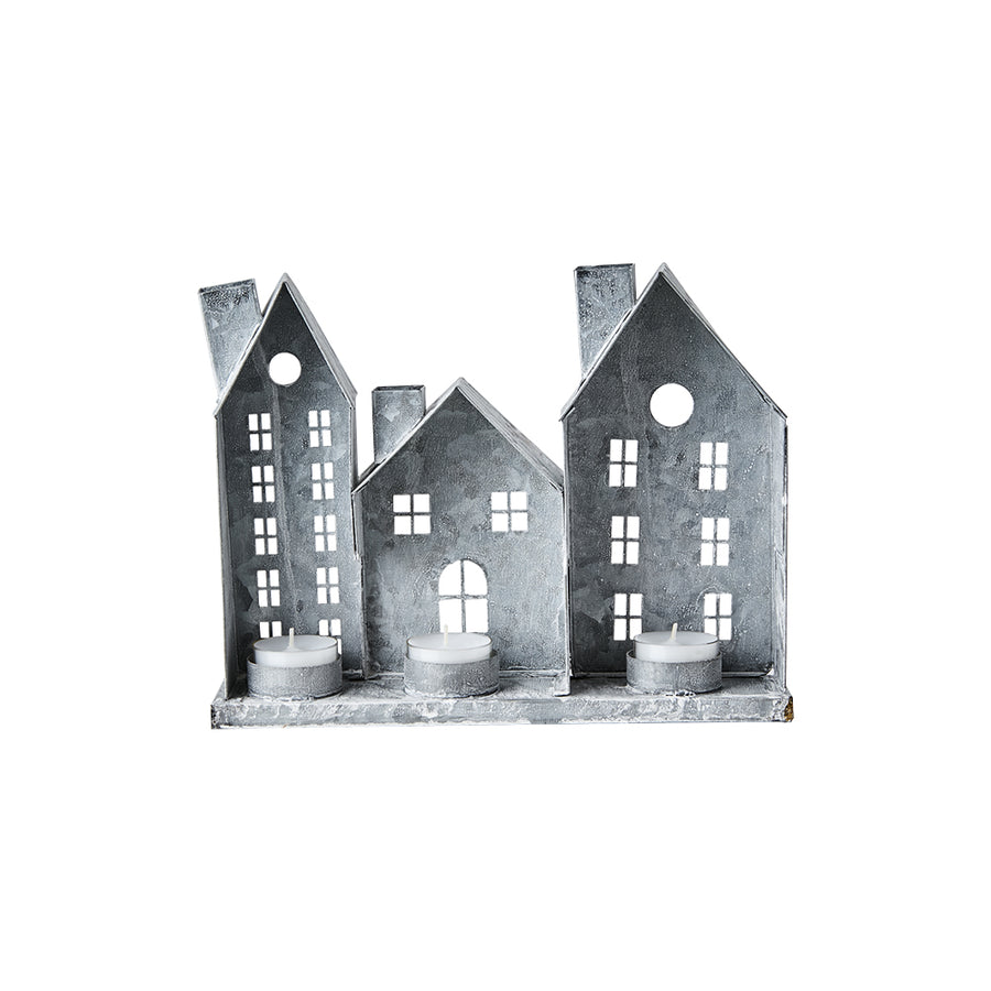 Szürke színű, bádogból készült házikókat formázó lámpás.