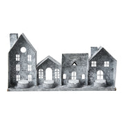 Szürke színű, bádogból készült házikókat formázó lámpás.