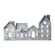 Szürke színű, bádogból készült házikókat formázó lámpás.