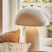 Bézs színű, gomba formájú, fém design asztali lámpa.