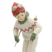 Heritage fehér karácsonyi síelő kisfiú figura közeli fotója.