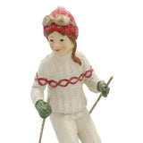 Heritage fehér karácsonyi síelő kislány figura részletfotó, kötött ruha és piros sapka