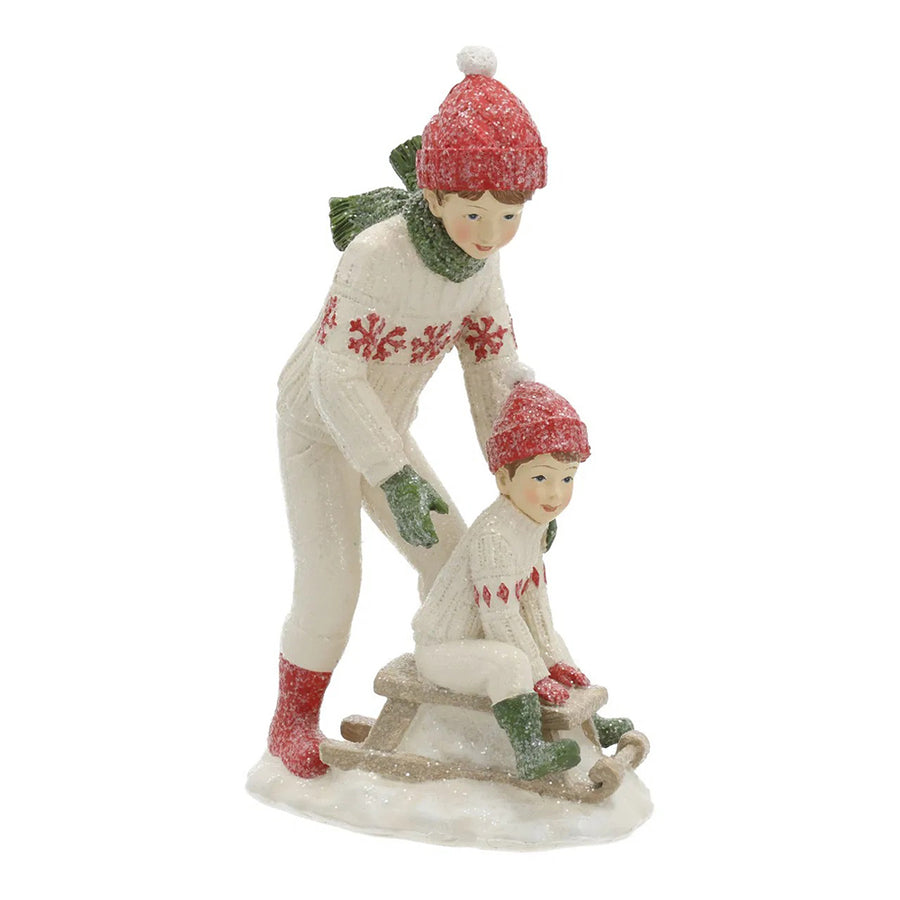 HERITAGE fehér karácsonyi szánkózó kisfiú figurák 19 cm – elölnézet