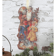 Fém Mikulás figura gyerekekkel.