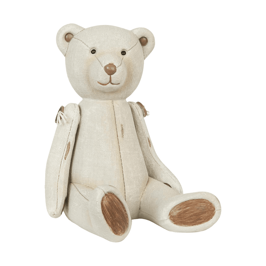 Krém színű antik maci figura vintage stílusban, ülő pozícióban.