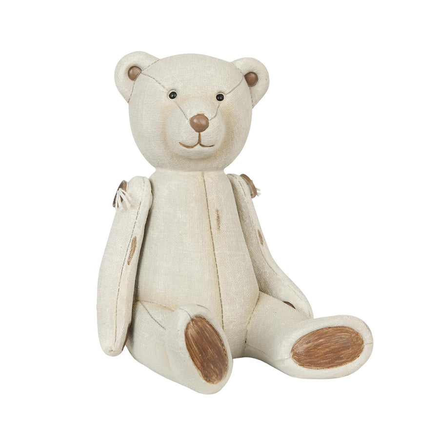 Krém színű antik maci figura vintage stílusban, ülő pozícióban.