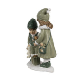 Heritage zöld karácsonyi gyerekpár figura oldalnézetben ajándékkal