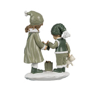 Heritage zöld karácsonyi gyerek figura hátulnézet hó talapzaton