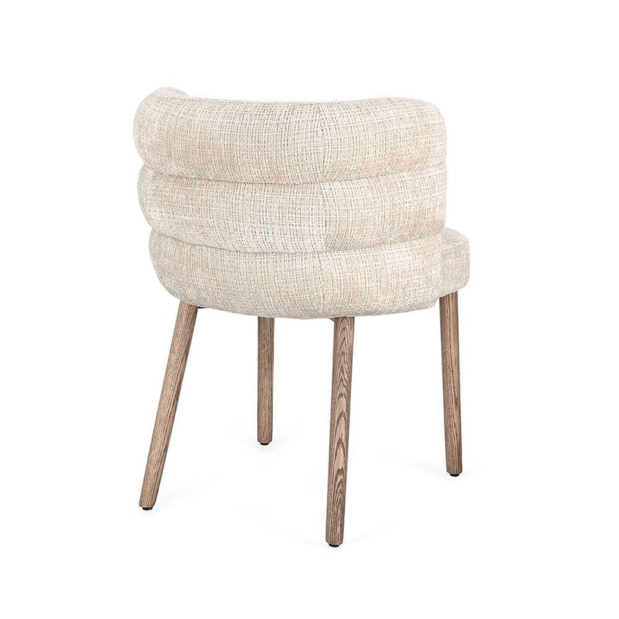 ILMA szék hátulról, íves párnázott háttámlával.