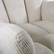 Bézs színű, kordbársony hatású szövettel kárpitozott design hintaszék.