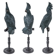 Türkiz színű, dekoratív kakadu figura.