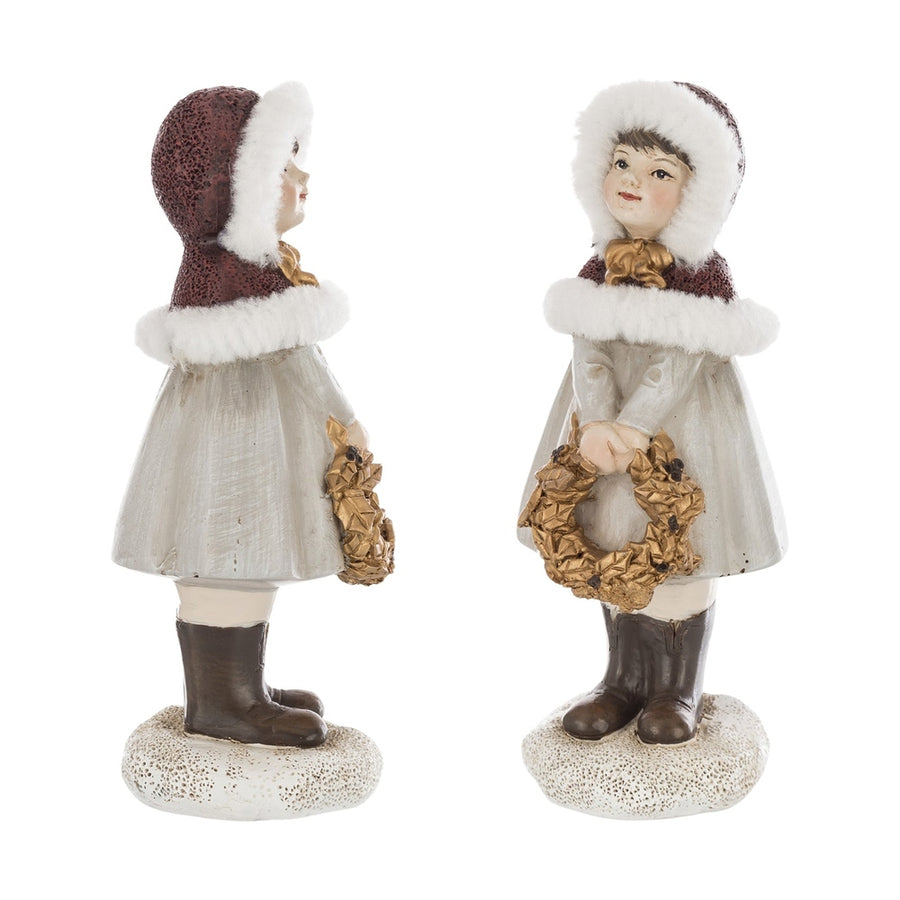 Krémszínű karácsonyi kislány figura.